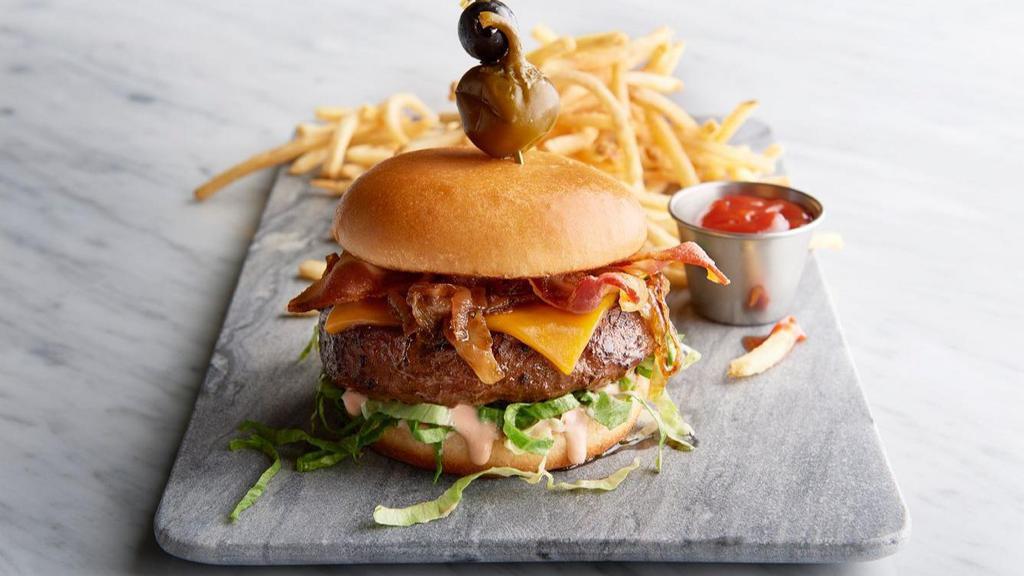 The Oceanaire Burger · Louie dressing, caramelised onion, lettuce and french fries.