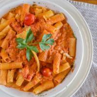 Rigatoni Con Vodka · Pink cream sauce with a hint of vodka and a little spice.