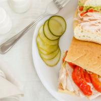 Turkey & Avocado · Roasted red peppers and garlic hummus avocado spread. Served on 9