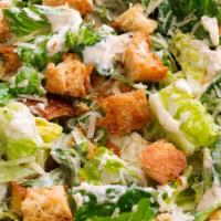 Caesar Salad · Romaine, Parmesan cheese and croutons with caesar dressing.