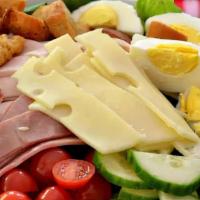 Chef Salad · Mixed greens, ham, salami, turkey, swiss, cheddar, tomato, cucumber, and egg.