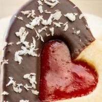 Linzer Tart Cookies · Raspberry Linzer Cookies sandwich bright and tangy raspberry jam between two almond cookies....