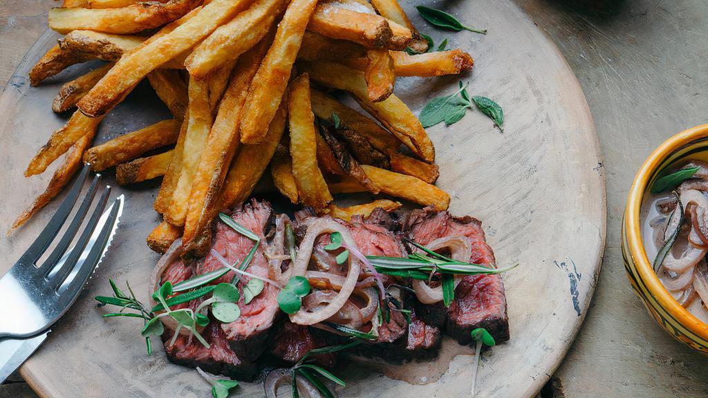Steak Frites · Hanger steak with red wine reduction, served with French fries.