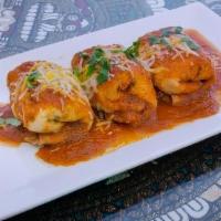 Fajita Chimichanga · Pocket with tender pulled chicken or ground beef with cheese, deep-fried to a delicate crisp...