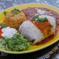 Classic Burrito · 10 inch soft flour tortilla pocket stuffed with pulled chicken or ground beef with cheese, t...