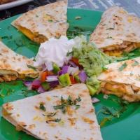 Grilled Chicken Quesadilla · Served with rice & baked pinto beans. Garnished with lettuce, pico de gallo, guacamole & sou...