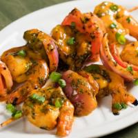 Shrimps · Flame grilled Jumbo shrimps on two skewers with grilled peppers and onions