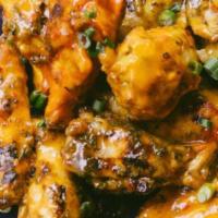 Wing Roulette · 10 wings randomly spiced with peri peri sauce. Add some sides to make it a meal