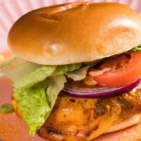 Gourmet Beef Burger · Succulent ground beef  flame grilled in peri peri sauce with cheese, red onions, lettuce, to...