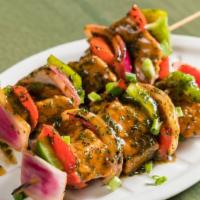 Vegan Kabob · Flame grilled seitan cubes served on two skewers with grilled peppers & onions.  Add some si...