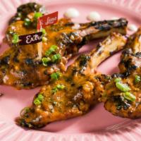 4 Lamb Chops · Flame grilled succulent French lamb rack chops.  Add some sides to make it a meal
