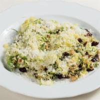 Crudo Di Cavolini · shaved Brussels sprouts, dried cranberries, toasted hazelnuts, Parmigiano-Reggiano