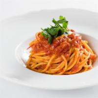 Spaghetti Al Pomodoro E Basilico · San Marzano tomato sauce, basil, 24-month aged Parmigiano-Reggiano
