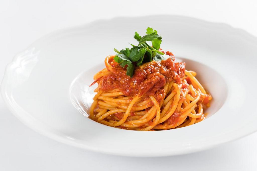 Spaghetti Al Pomodoro E Basilico · San Marzano tomato sauce, basil, 24-month aged Parmigiano-Reggiano