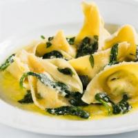 Ravioli Della Casa · handmade ricotta filled ravioli, sauteed spinach, butter and sage