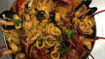 Paella For 1 · Authentic Spanish sollanan rice infused with saffron and scallions. Lobster, shrimp, mussels...