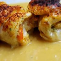 Shrimp Stuffed Chicken Breast · Lightly breaded chicken breast stuffed with tender shrimp in a creamy white wine and garlic ...