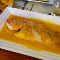 Whole Red Snapper In Coconut Sauce · Steamed whole red snapper served in a Caribbean coconut sauce with onions and peppers.