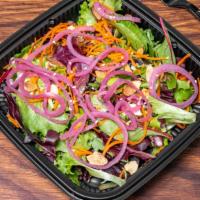 Nutty Salad · Mix greens, carrots, roasted almonds, pickled onions and sesame seeds. Served with a sesame ...