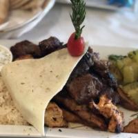 Mixed Grill Plate · Special Marinated Lamb   and Chicken Meat  Combinations.
