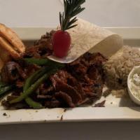 Doner/Gyro · Lamb Gyro Served With Rice, Fries and Chef's Sauce.