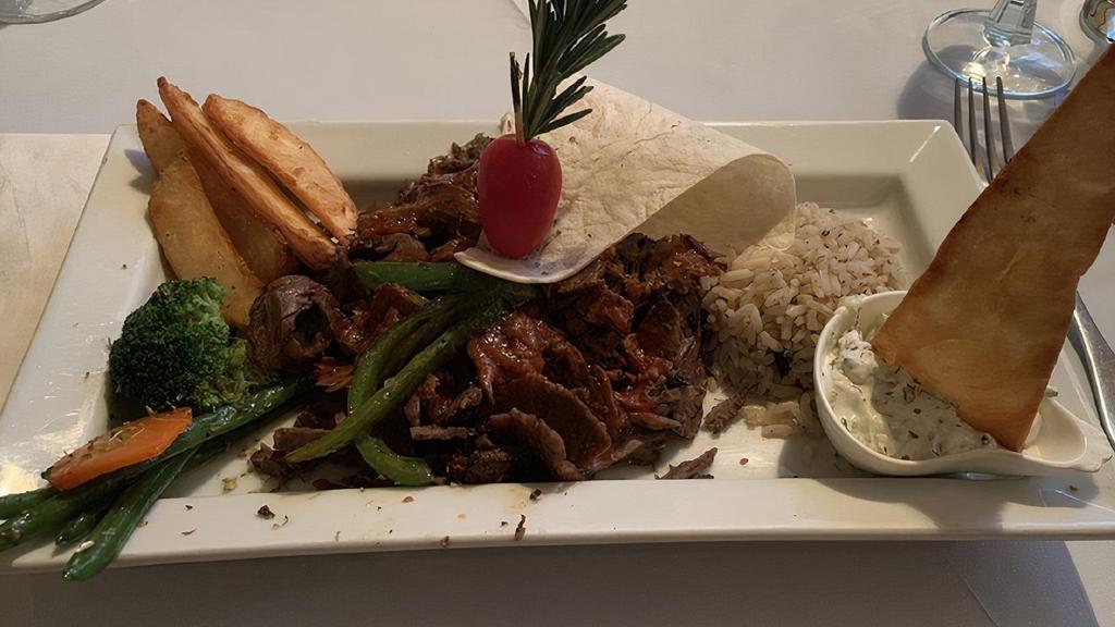 Doner/Gyro · Lamb Gyro Served With Rice, Fries and Chef's Sauce.