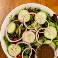 House Salad · Organic mixed greens, grape tomatoes, cucumbers, red onions, oil and vinegar.