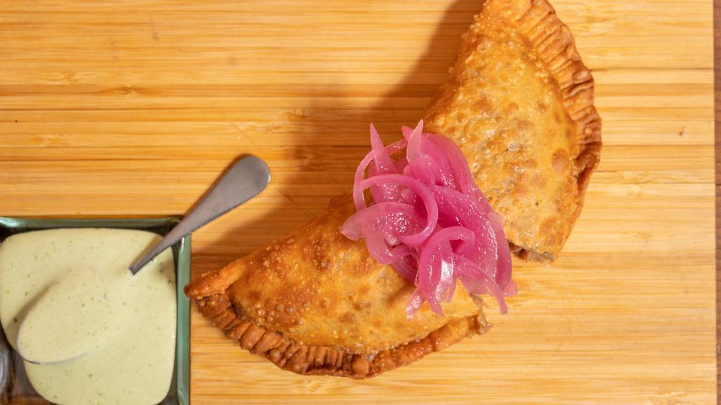 La Habana’S Empanada   · Filled with Pulled Pork, Ham, Swiss & Pickles
 served w/ Mustard Aioli