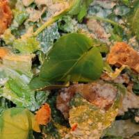Caesar Salad · Chopped Romaine Hearts, Parmigiano Reggiano, Rosemary-Pecorino Focaccia Crisps, Zesty Caesar...