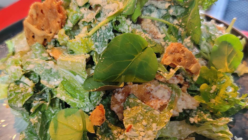 Caesar Salad · Chopped Romaine Hearts, Parmigiano Reggiano, Rosemary-Pecorino Focaccia Crisps, Zesty Caesar Dressing