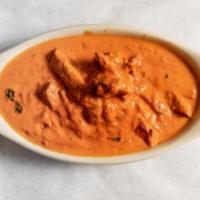 Butter Chicken · Boneless chicken tikka cooked with pure butter, almonds, and creamy and special sauce.