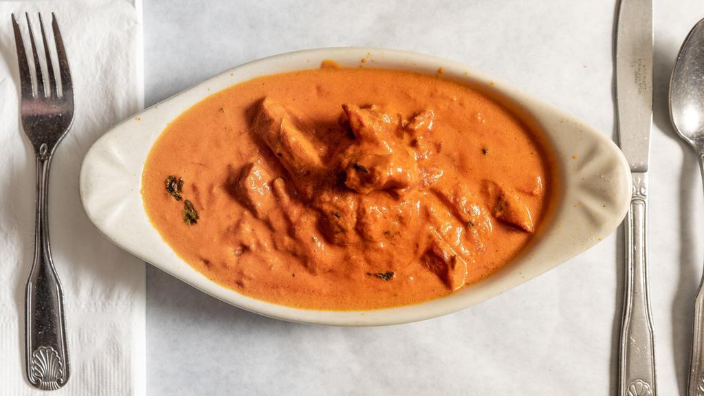 Butter Chicken · Boneless chicken tikka cooked with pure butter, almonds, and creamy and special sauce.