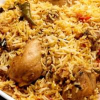 Chicken Biryani · Long grain flavored basmati rice cooked with boneless chicken, eggs, nuts, and exotic mild s...