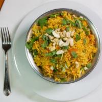 Vegetable Biryani · Distinctly flavored long grain basmati rice cooked with fresh vegetables, nuts, eggs, and mi...