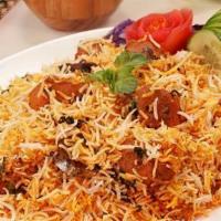 Chicken Tikka Biryani · Boneless chicken tikka cooked with long grain Indian basmati rice, eggs, nuts, and exotic mi...