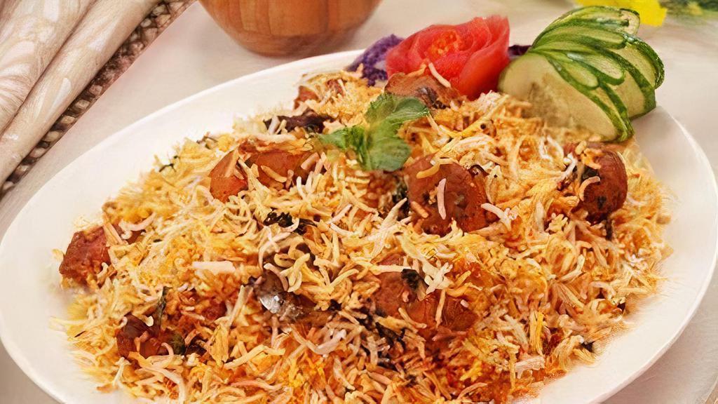 Chicken Tikka Biryani · Boneless chicken tikka cooked with long grain Indian basmati rice, eggs, nuts, and exotic mild spices.