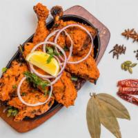 Tandoori Chicken · Half chicken marinated with yoghurt, mild spices and herbs and grilled in tandoor clay oven.