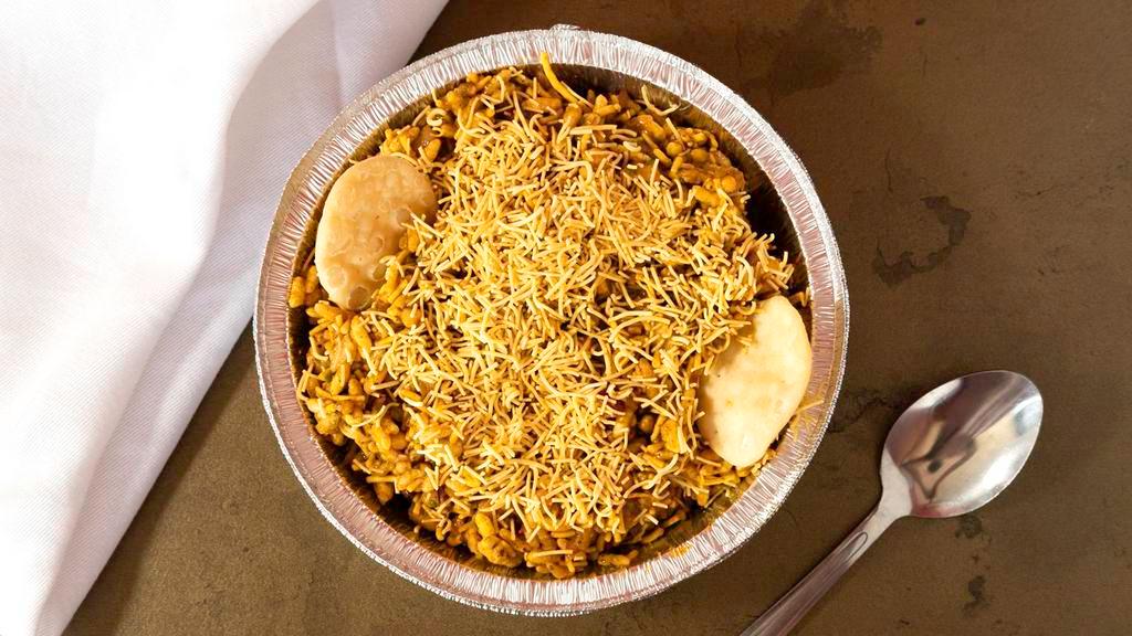 Bhel Poori · Vegetarian. Rice puffs tossed with potatoes, onions, tomatoes cilantro, green chili and chat masala.