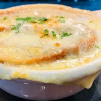 French Onion Soup · Gruyère and Emmenthal Cheese, Baguette Crouton.