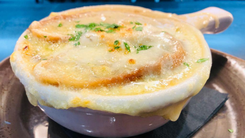 French Onion Soup · Gruyère and Emmenthal Cheese, Baguette Crouton.
