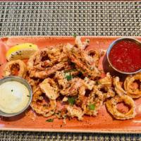 Crispy Calamari · Herb Aioli, Marinara, Lemon Wedge.