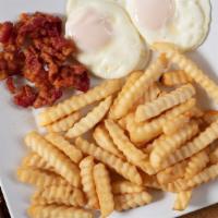# 2 - Huevos Con Jamon Or Tosineta Y Papas Fritas · Two eggs any style with bacon or ham and fries.