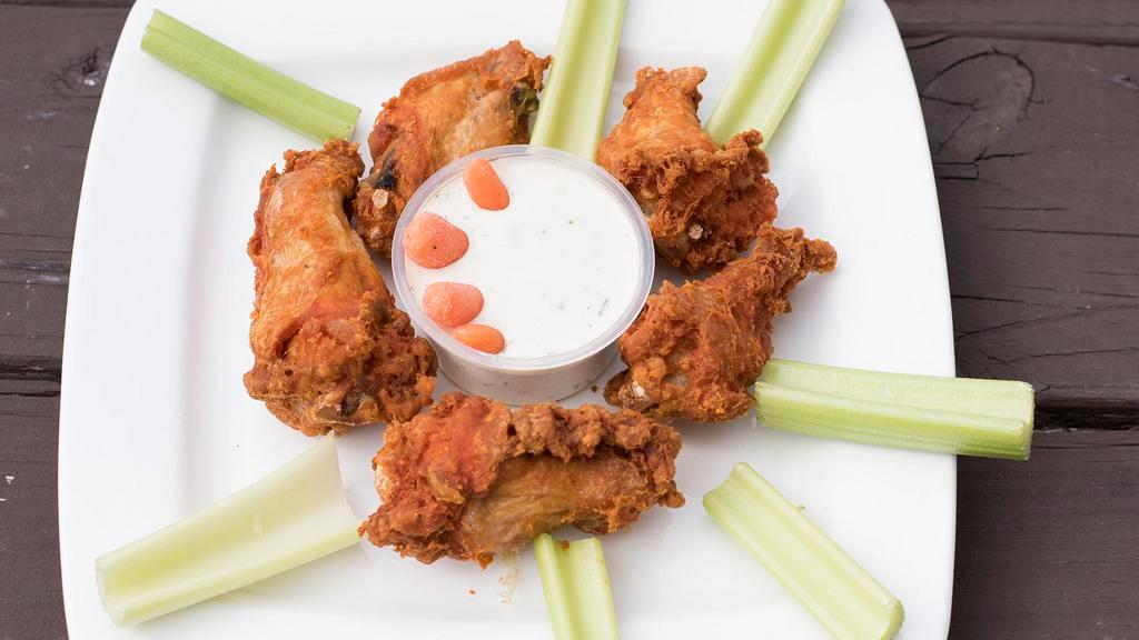 Taphouse Wings · Fried and finished on the grill. Served with our house sauce or with classic buffalo sauce with celery and bleu cheese.