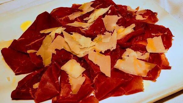 Carpaccio Di Bresaola · Air-dried cured beef (bresaola) carpaccio, shaved parmigiano cheese, evo.