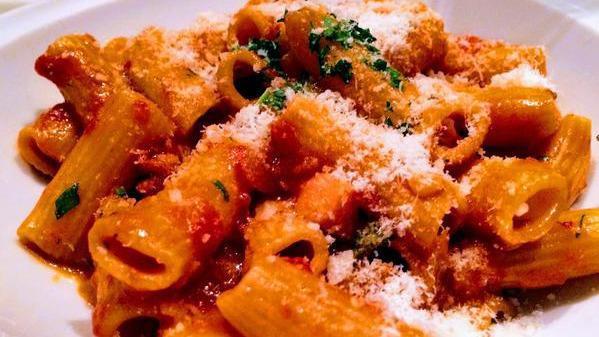 Rigatoni All'Amatriciana · Spicy. Homemade rigatoni, tomato sauce, pancetta, onions, red pepper flakes, parmigiano cheese.