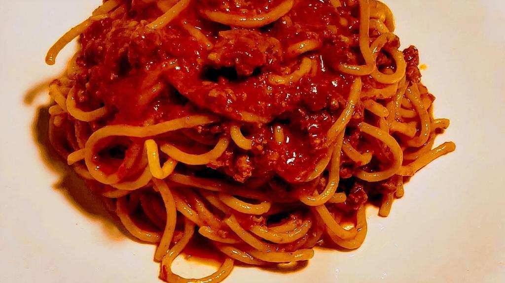 Tagliatelle Alla Bolognese · Homemade spaghetti, grass fed beef ragout, light tomato sauce, parmigiano cheese.