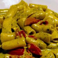 Gemelli Al Pesto · Vegan. Homemade gemelli, basil pesto sauce, cherry tomatoes, touch of cream, parmigiano chee...