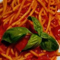 Spaghetti Al Pomodoro · Vegan. Homemade spaghetti, tomato sauce, cherry tomatoes confit, parmigiano cheese.