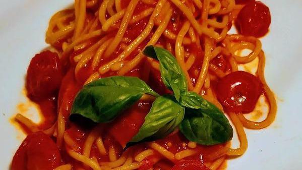 Spaghetti Al Pomodoro · Vegan. Homemade spaghetti, tomato sauce, cherry tomatoes confit, parmigiano cheese.