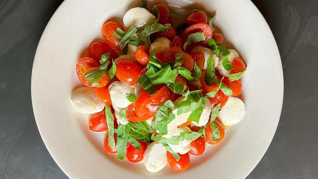 Tomato Mozzarella · Fresh mozzarella, tomatoes, olive oil and basil